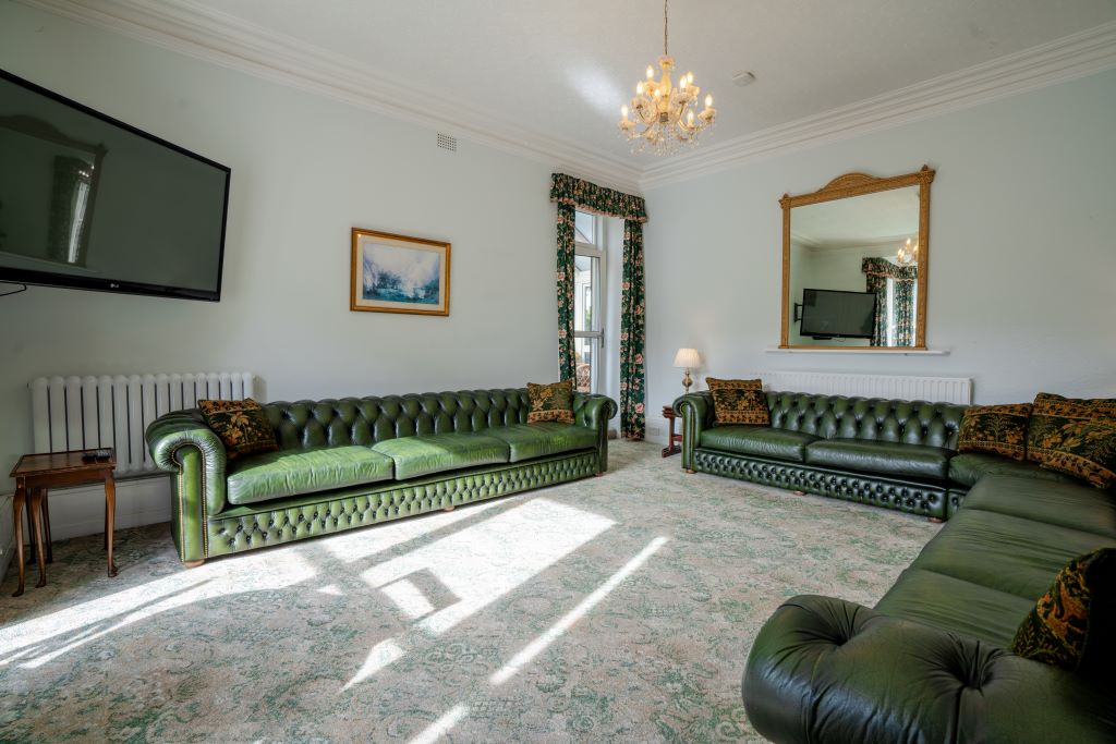 Plenty of seating on our Chesterfields and a big TV in the lounge